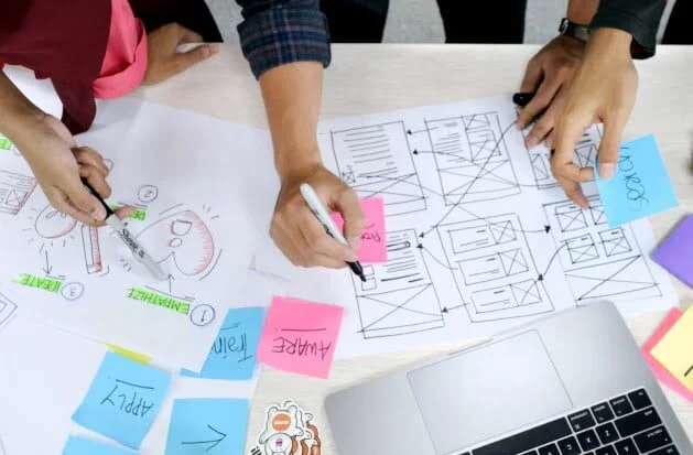 Students working together from the Diploma of User Experience Design course at the Australian Pacific College