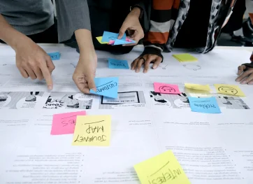 Students working together from the Diploma of User Experience Design course at the Australian Pacific College
