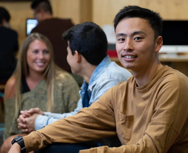 Australian Pacific College students chatting in the student library